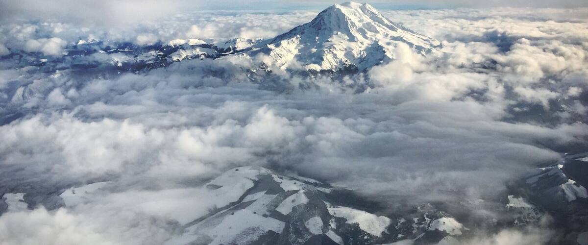 Flying over Mt. Rainier on my way down to California...this is the most amazing view of the Mt. Rainier I've ever had... (Not too bad shooting through the dirty window with an iPhone ;)