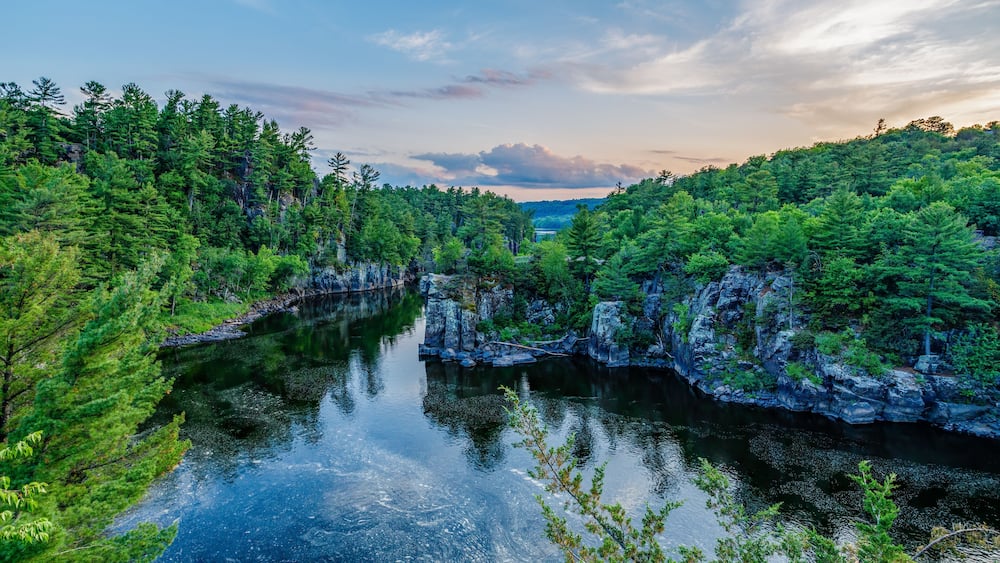 St. Croix River during sunset with colorful sky at Interstate State Park in St. Croix Falls Wisconsin.