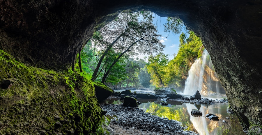 Haew Suwat Waterfall Khao Yai National Park, Nakhon Ratchasima, Thailand Waterfall view from the inside of the cave. Seeing is a beautiful rainbow
