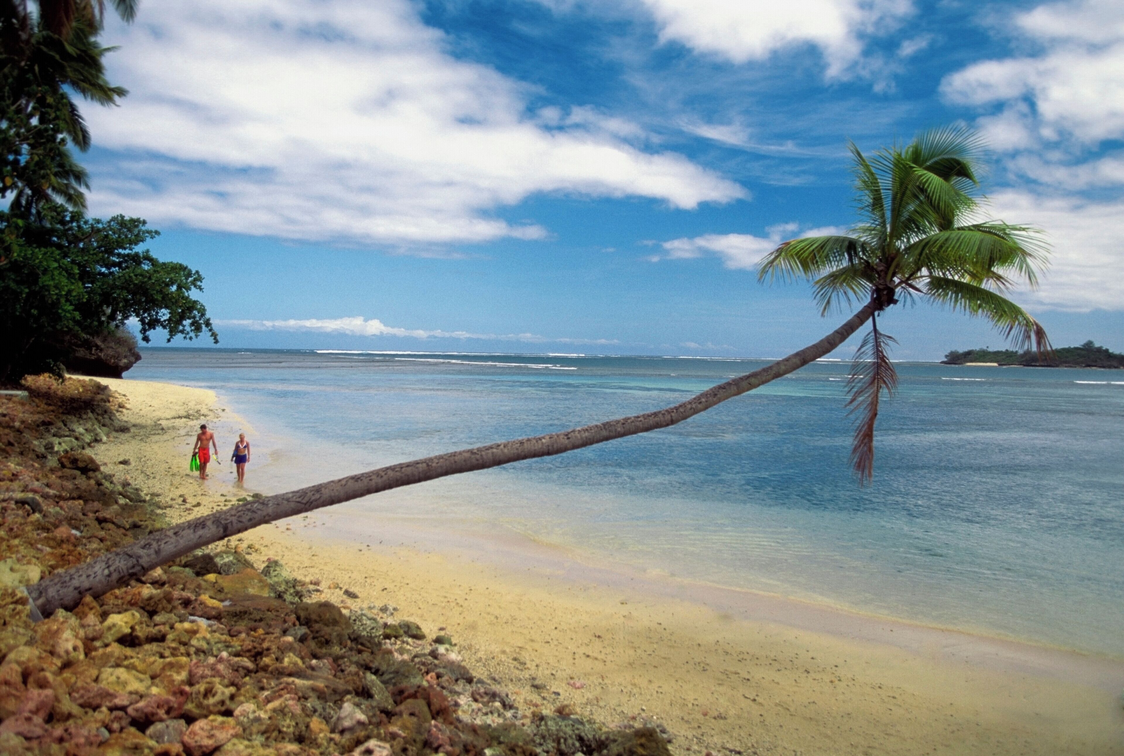 Two people walking on Warwick Resort Beach, Nadi, Viti Levu Island, Fiji