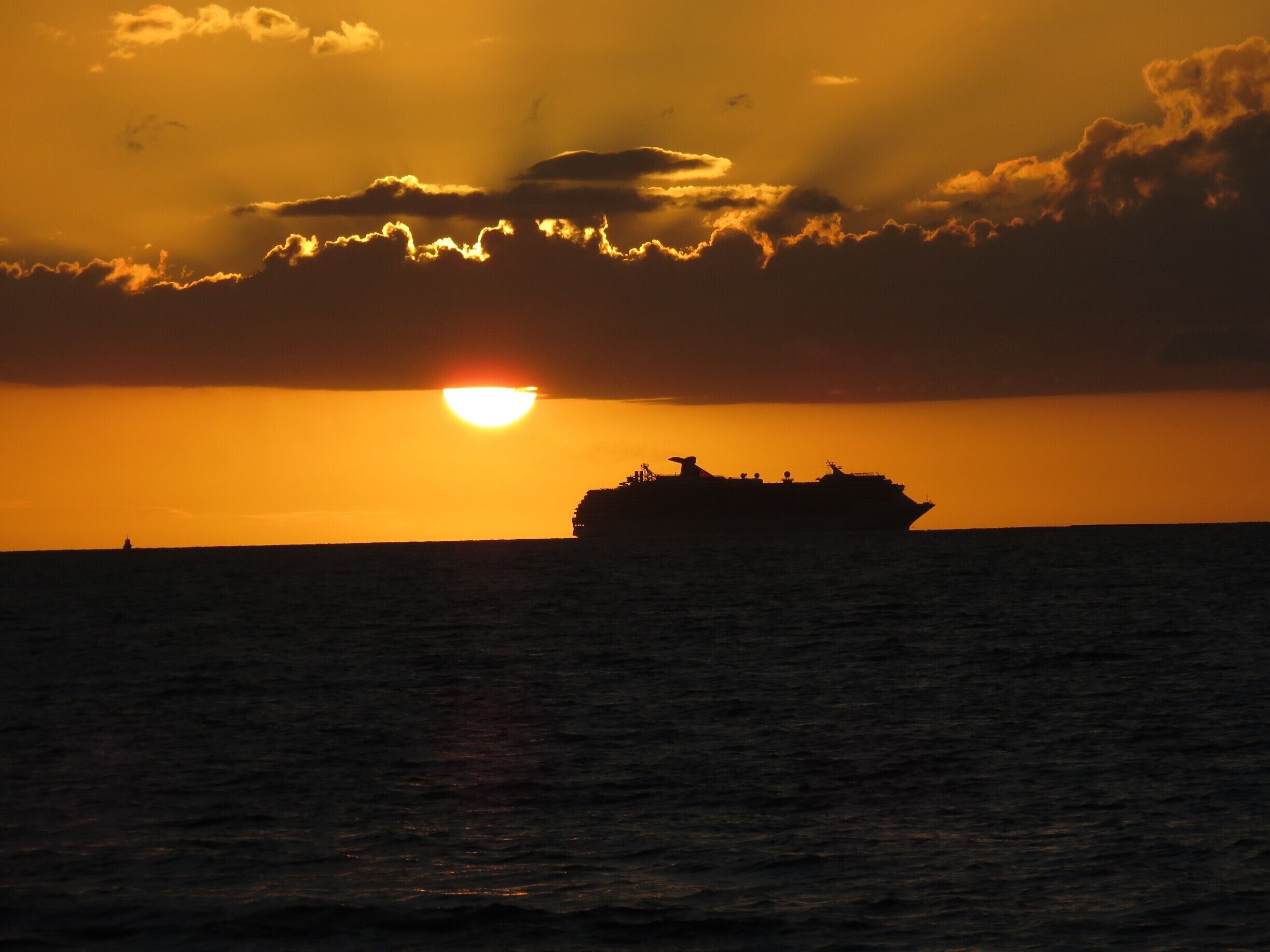 Awesome sunset from Wailoaloa Beach. Looks like the cruise ship is going to burst into flame...