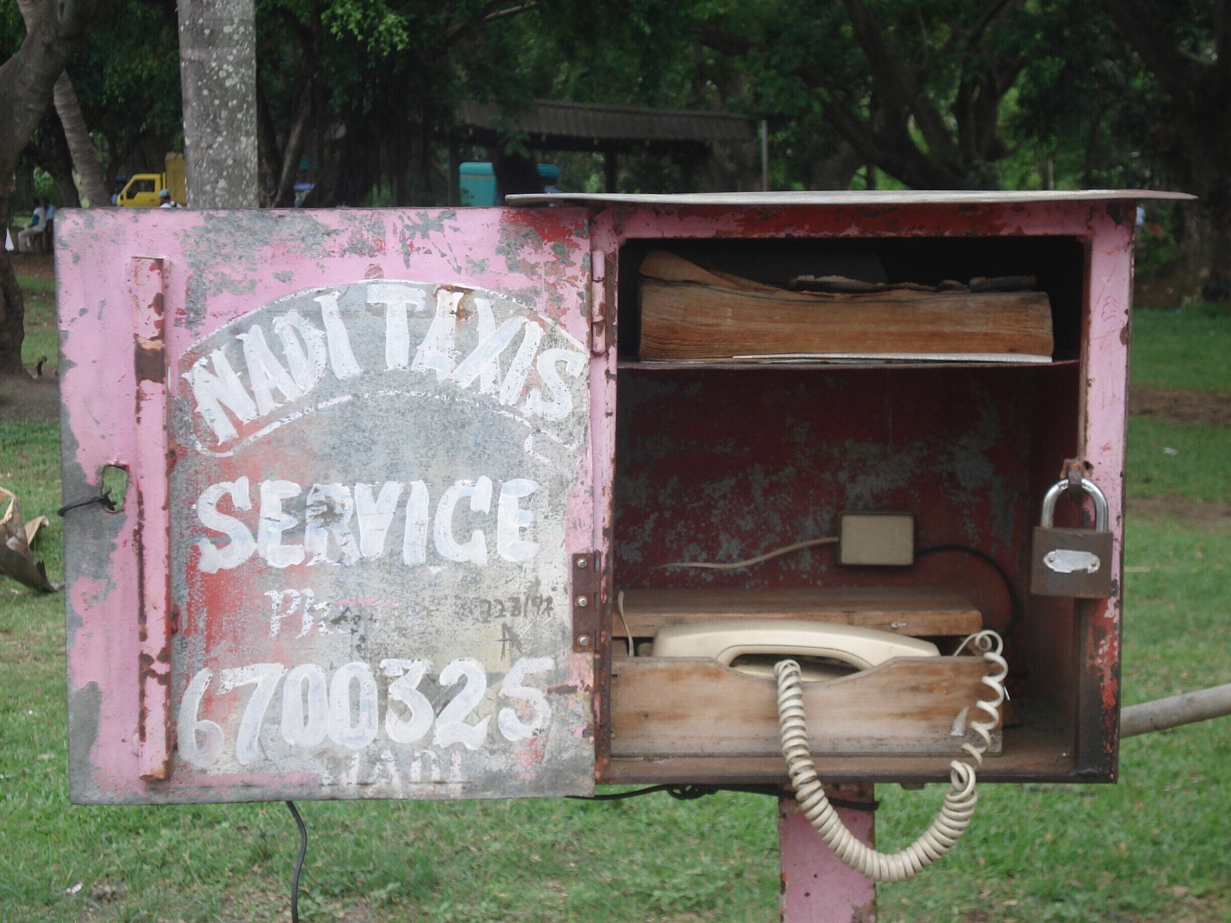 Taxi! 

Local taxi service in Nadi, Fiji. Complete with telephone and phone book, this little box could take you anywhere. What else do you need...