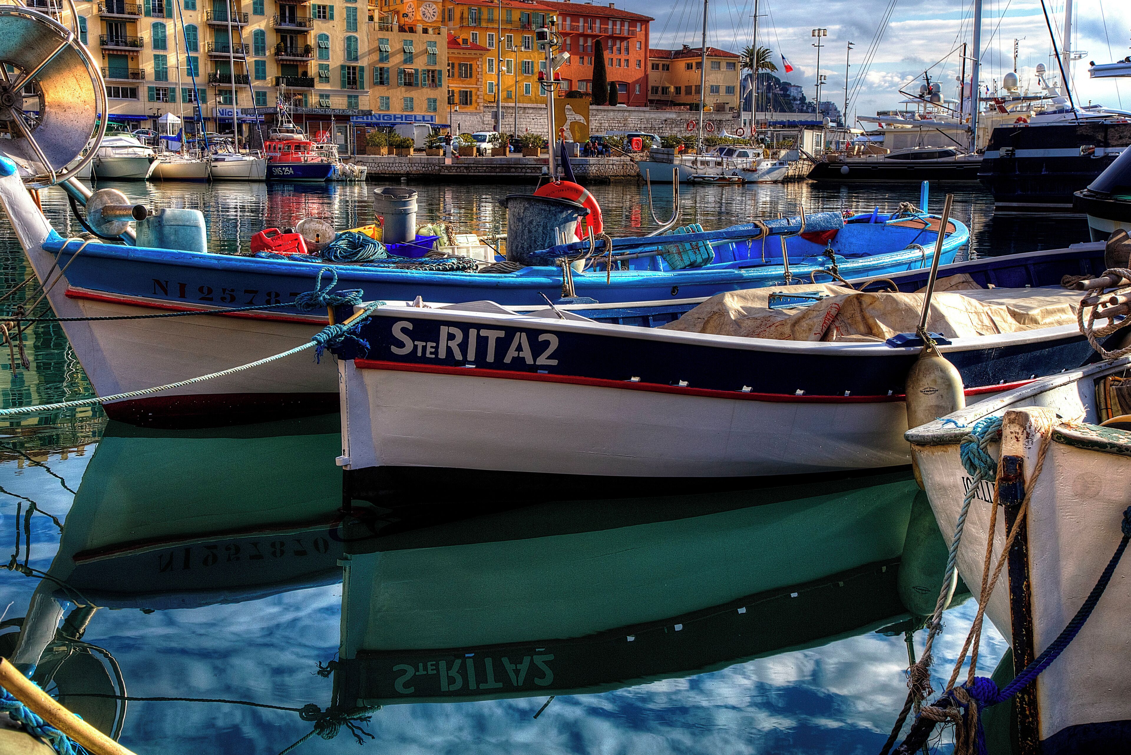 the haven of the harbour is a pretty sight with the boats and buildings surrounding the bay