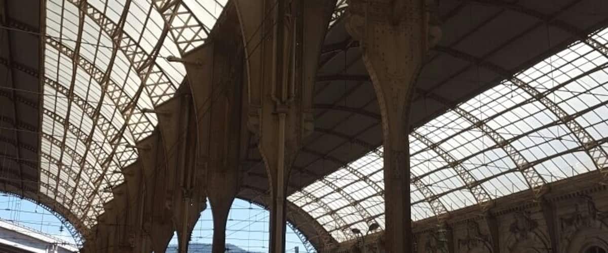 Unles you're savvy with French and their ticket machines, best you queue up at counter to purchase your ticket.  Leave plenty of time to do this as it can get crowded.  Then wait to find out which platform to catch your train from - 20mins prior to departure time.