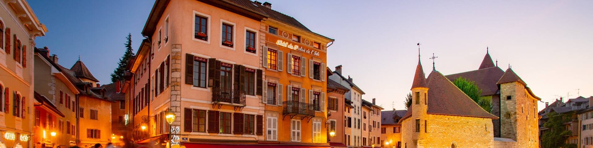 Annecy featuring a sunset and a river or creek