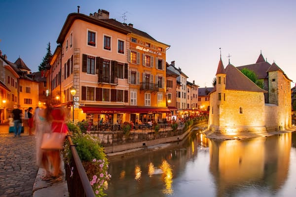 Annecy featuring a sunset and a river or creek