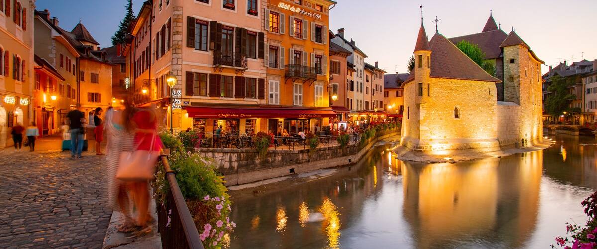 Annecy featuring a sunset and a river or creek