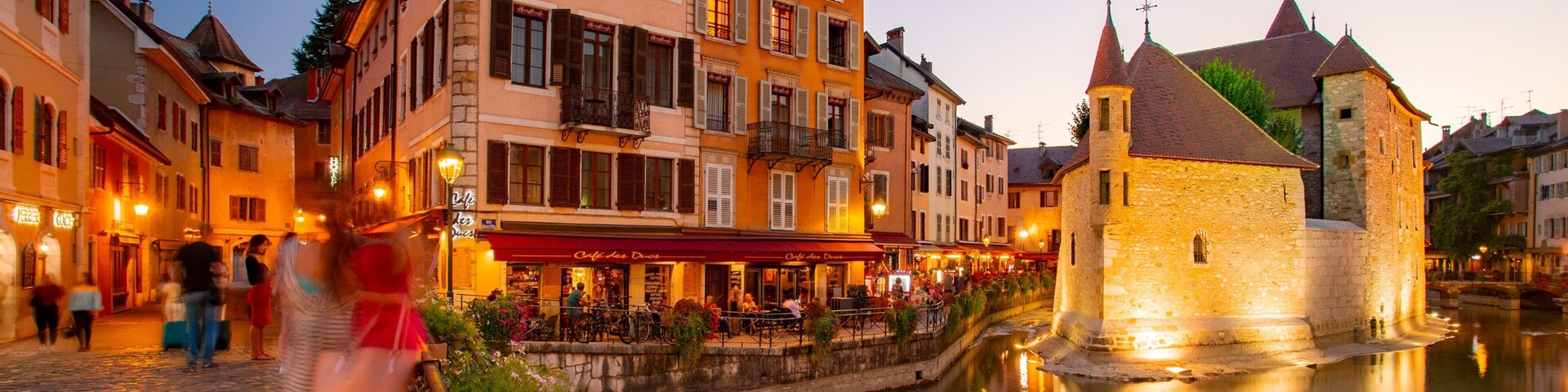Annecy featuring a sunset and a river or creek