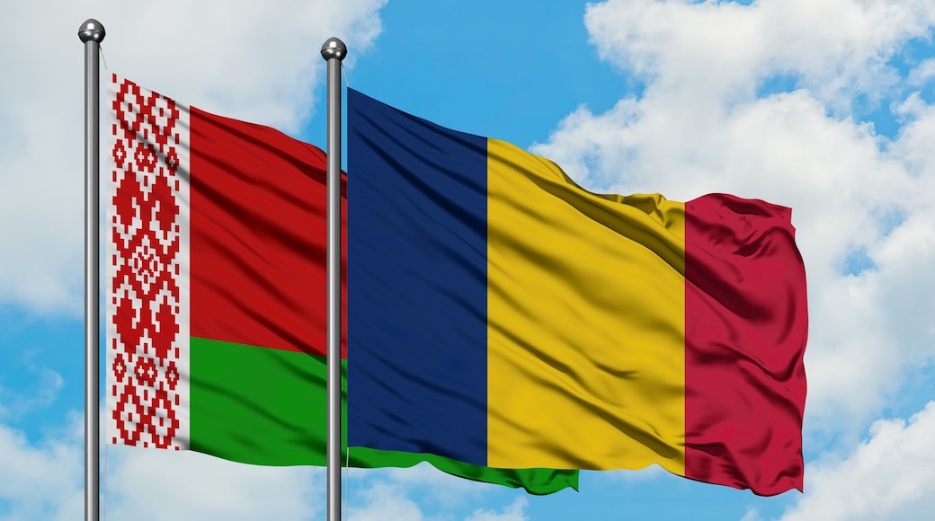 Belarus and Chad flag waving in the wind against white cloudy blue sky together. Diplomacy concept, international relations.