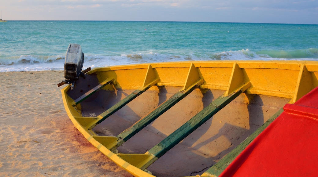 Negril showing a sandy beach and boating