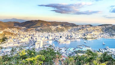 Business concept, modern cityscape of nagasaki dusk from mount inasa, the new top 3 nightview of the world, aerial view, copy space