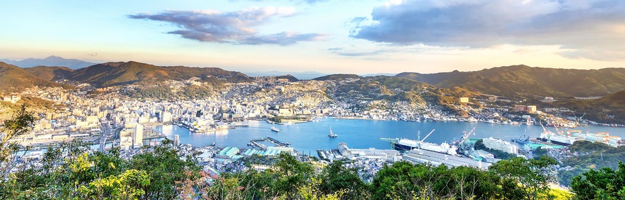 Business concept, modern cityscape of nagasaki dusk from mount inasa, the new top 3 nightview of the world, aerial view, copy space