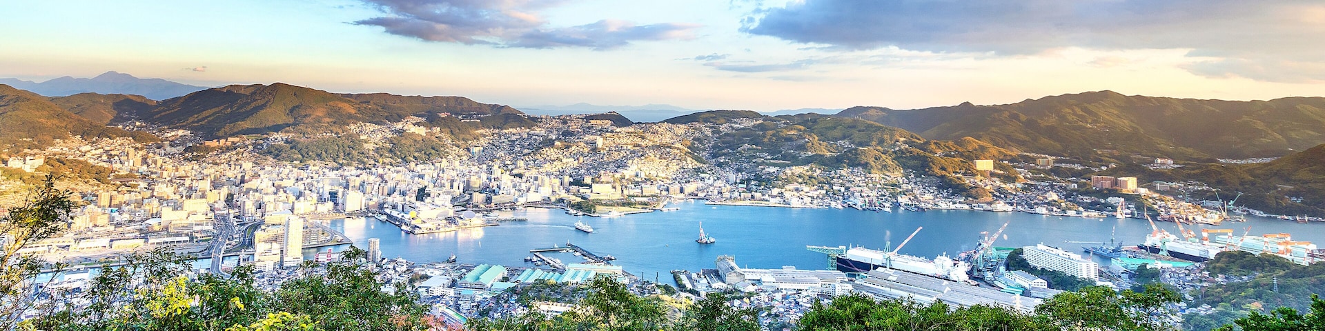 Business concept, modern cityscape of nagasaki dusk from mount inasa, the new top 3 nightview of the world, aerial view, copy space