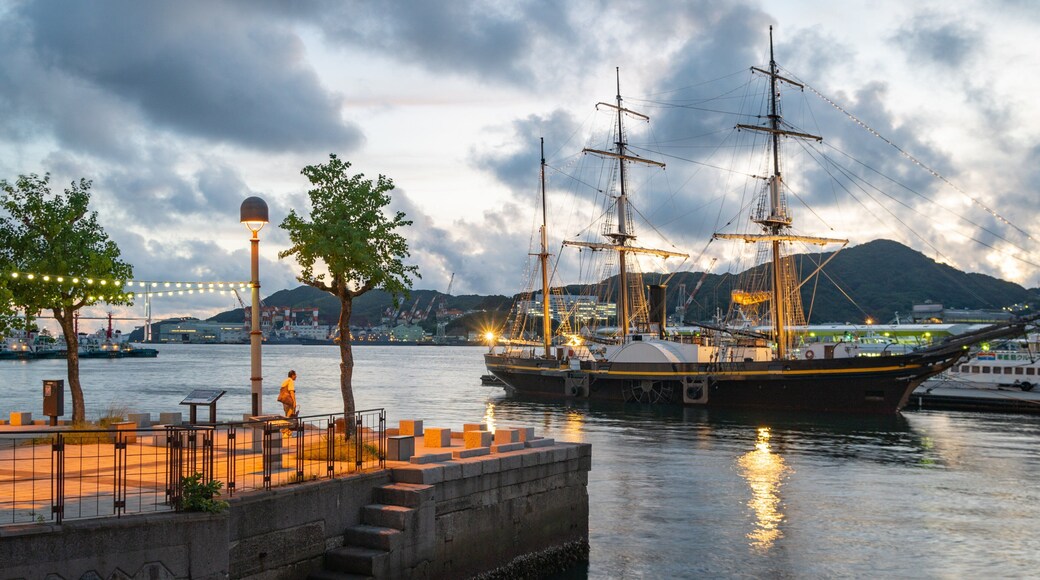 Nagasaki featuring a sunset, a bay or harbor and heritage elements