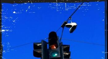 Somebody forgot their shoes next to the traffic signal...