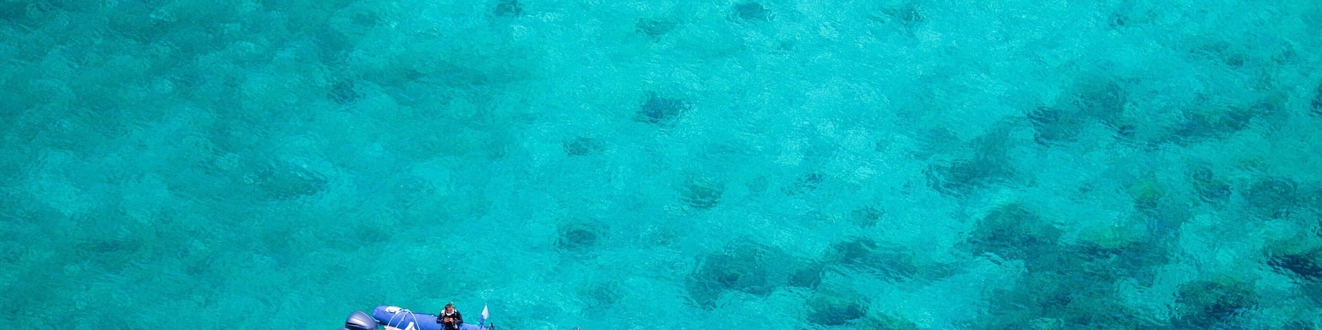 Noumea featuring boating and general coastal views as well as a small group of people