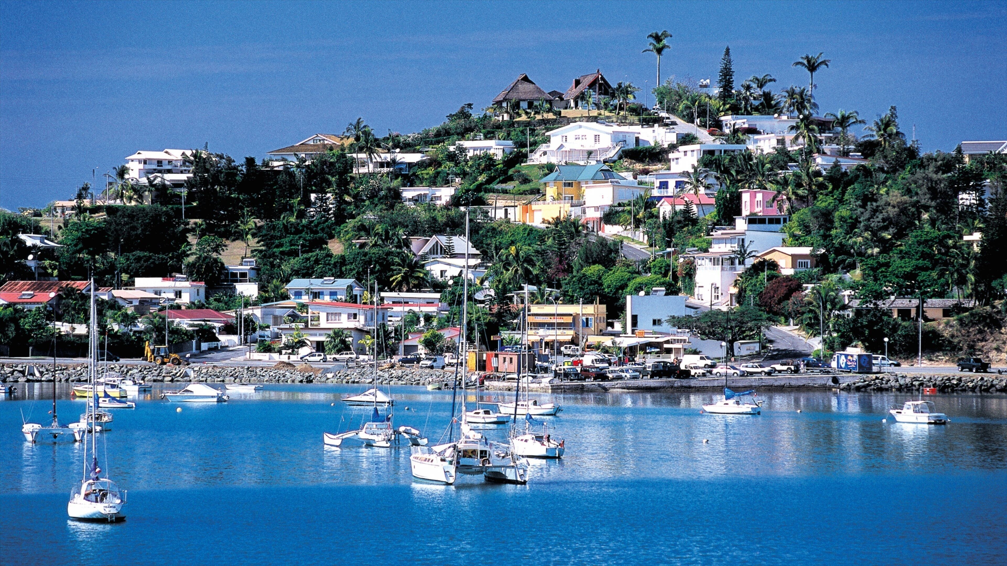 New Caledonia featuring a coastal town and a bay or harbor