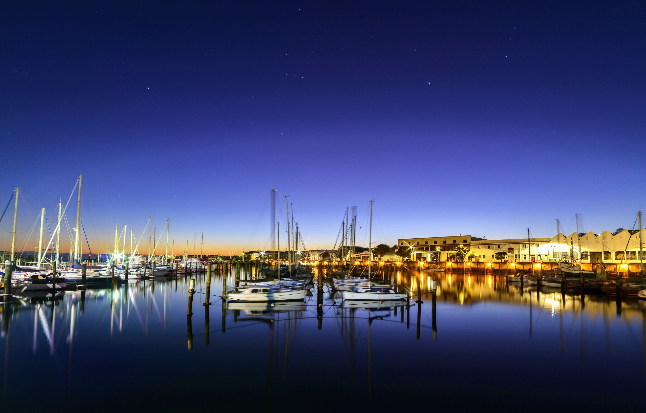 The original port of Napier was located in the area of Ahuriri, just beyond the buildings visible on the right of this photo., and was known as the Iron Pot port.

This port area has now been superseded by the Breakwater Port, and Ahuriri is home to mainly pleasure boats and inshore fishing vessels, and the old warehouses and stores are now home to restaurants, bars, cafe's, offices and apartments.

It was very peaceful this morning standing watching the stars fade and the sun rise, and people arriving to take their boats out for the day.

The constellation of Orion is visible in this photo in the centre of the sky.