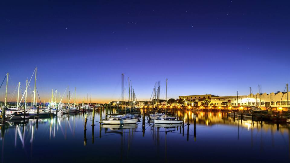 The original port of Napier was located in the area of Ahuriri, just beyond the buildings visible on the right of this photo., and was known as the Iron Pot port.
This port area has now been superseded by the Breakwater Port, and Ahuriri is home to mainly pleasure boats and inshore fishing vessels, and the old warehouses and stores are now home to restaurants, bars, cafe's, offices and apartments.
It was very peaceful this morning standing watching the stars fade and the sun rise, and people arriving to take their boats out for the day.
The constellation of Orion is visible in this photo in the centre of the sky.