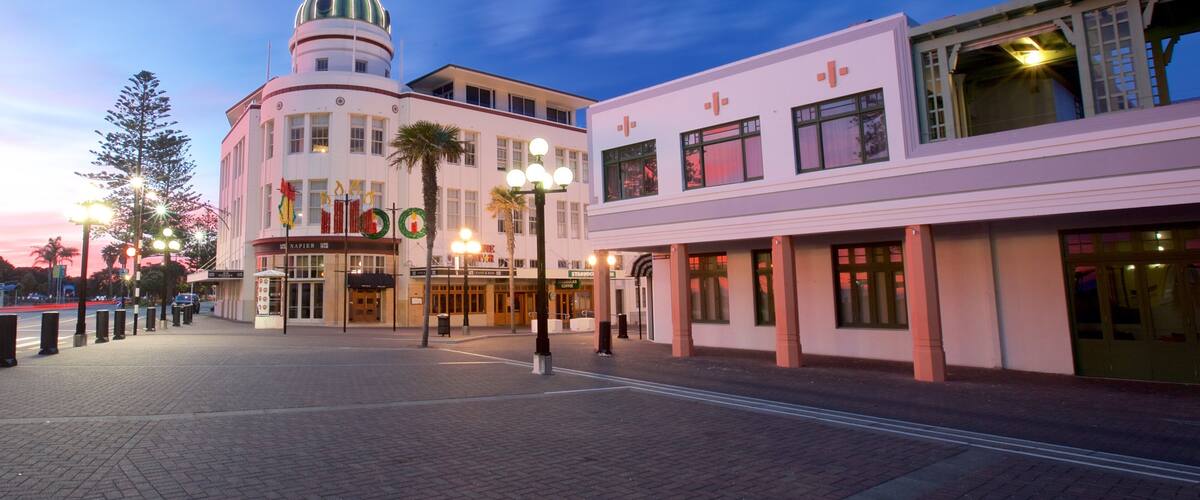 A historic building with a clock tower, a theater, and a Starbucks.