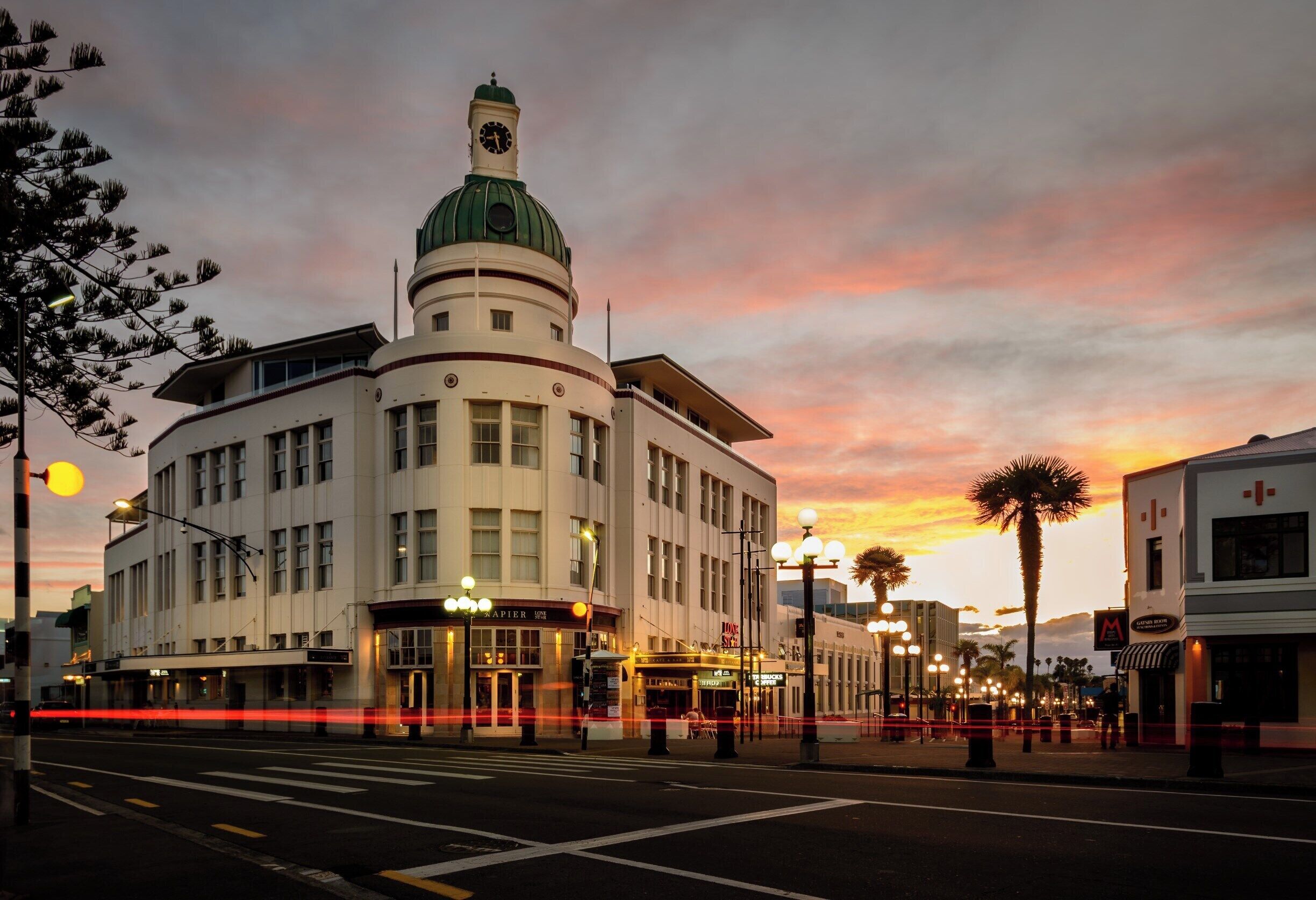 This is Marine Parade in Napier.

Napier is regarded as one of the most complete examples of an Art Deco city in the world, having been rebuilt after a large 1931 earthquake.

The T&G Building shown here has been converted into high end apartments and entertainment spaces and is one of the landmarks of Art Deco Napier

