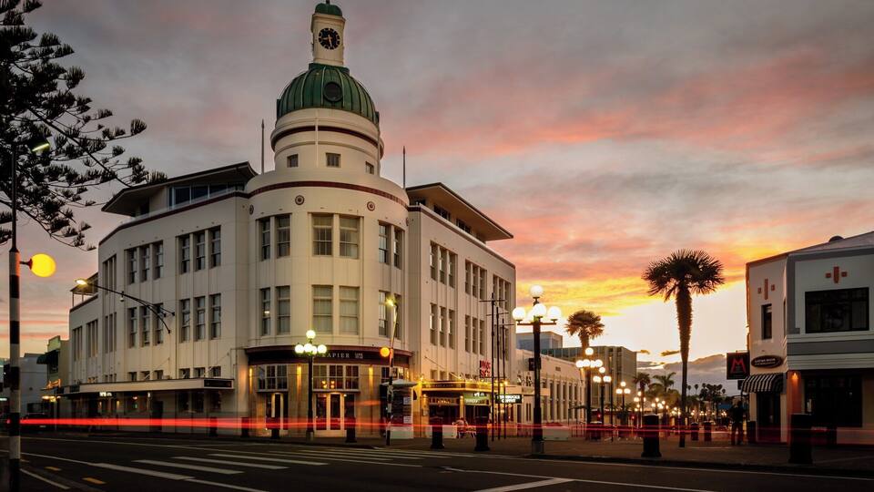 This is Marine Parade in Napier.
Napier is regarded as one of the most complete examples of an Art Deco city in the world, having been rebuilt after a large 1931 earthquake.
The T&G Building shown here has been converted into high end apartments and entertainment spaces and is one of the landmarks of Art Deco Napier