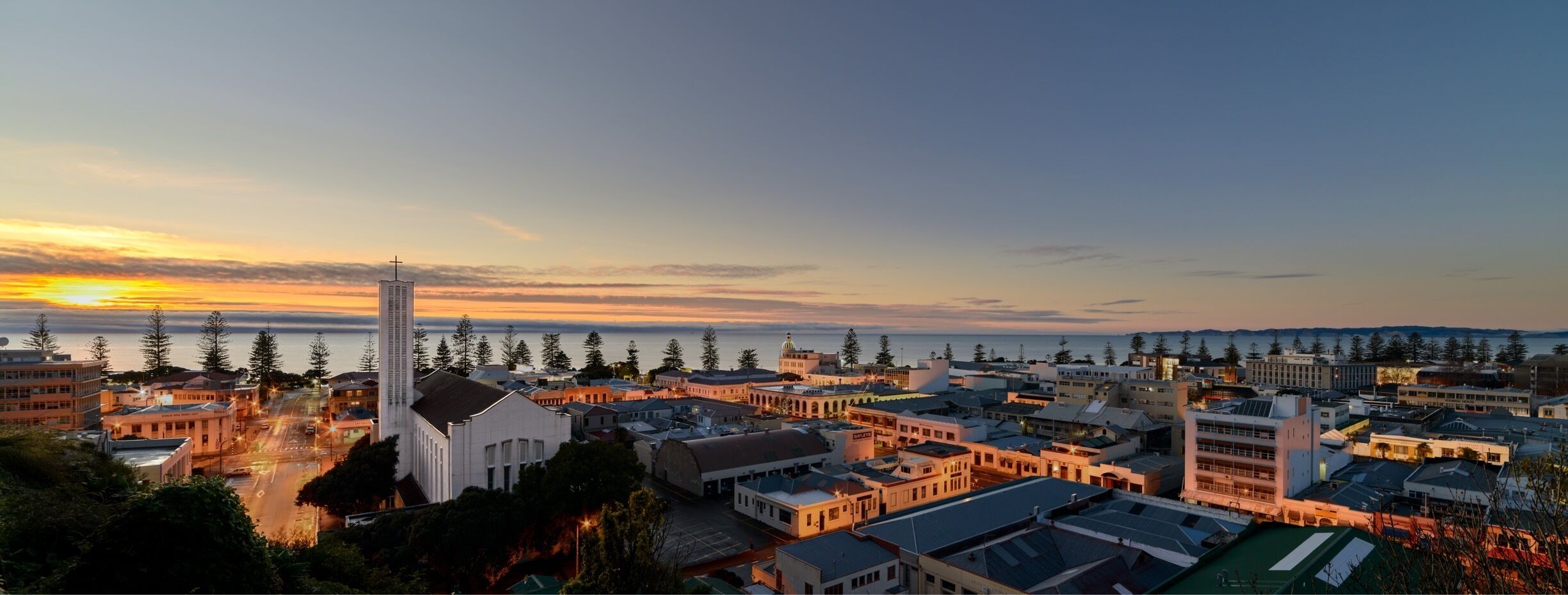 Dawn rises over the city of Napier, with St Paul's Cathedral to the left of shot 