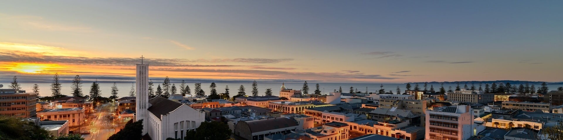 Dawn rises over the city of Napier, with St Paul's Cathedral to the left of shot