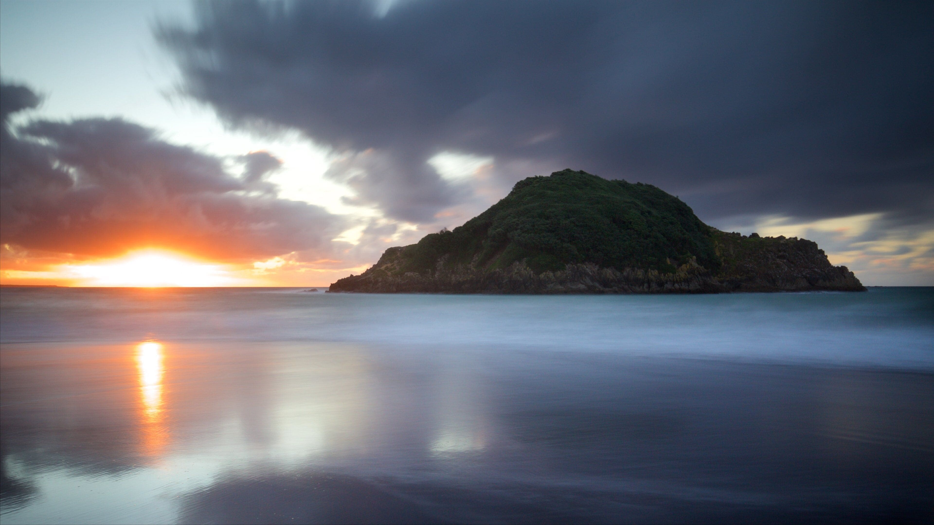 New Plymouth featuring a sunset, island images and a bay or harbor