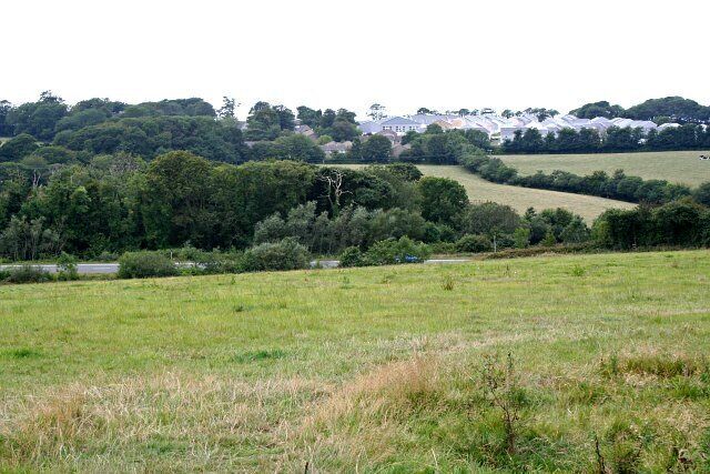 Across the Valley to Killaworgey. This photograph was taken from just outside the eastern edge of this grid square and looks out over the valley and the main A39 road to a new housing development at Killaworgey.