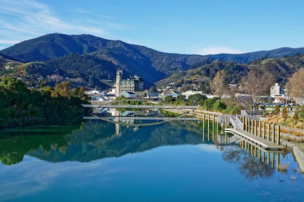 Panorama of Nelson City, reflected in the Maitai River, New Zealand.