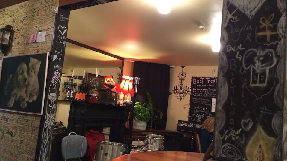 East st cafe & bar. Funky as vegeterian joint under back packers. The plant in corner is a huge basil