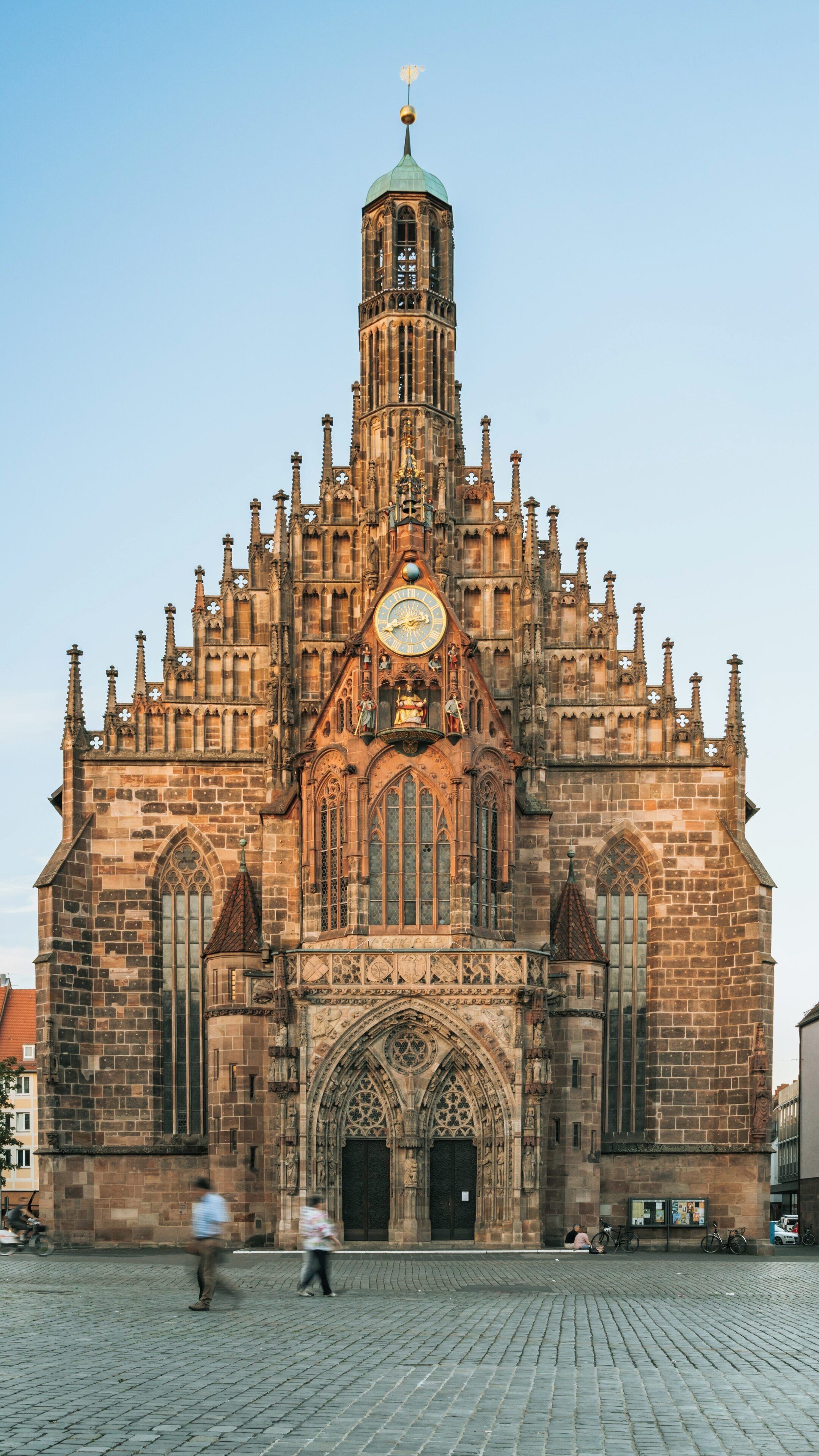 Frauenkirche stands majestically in Nuremberg's Old Town, showcasing stunning Gothic architecture and rich history under a clear blue sky