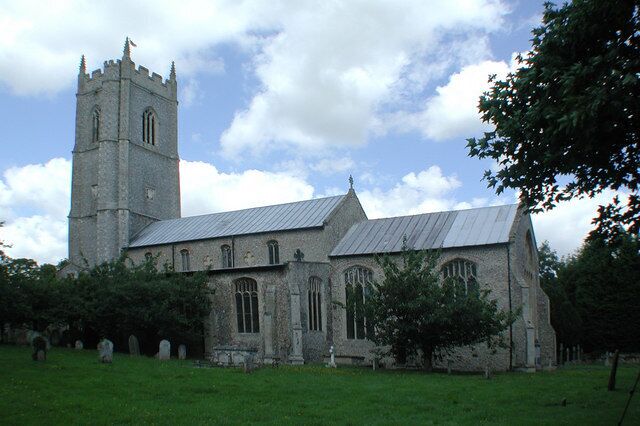 A historic church with a tall tower and arched windows.