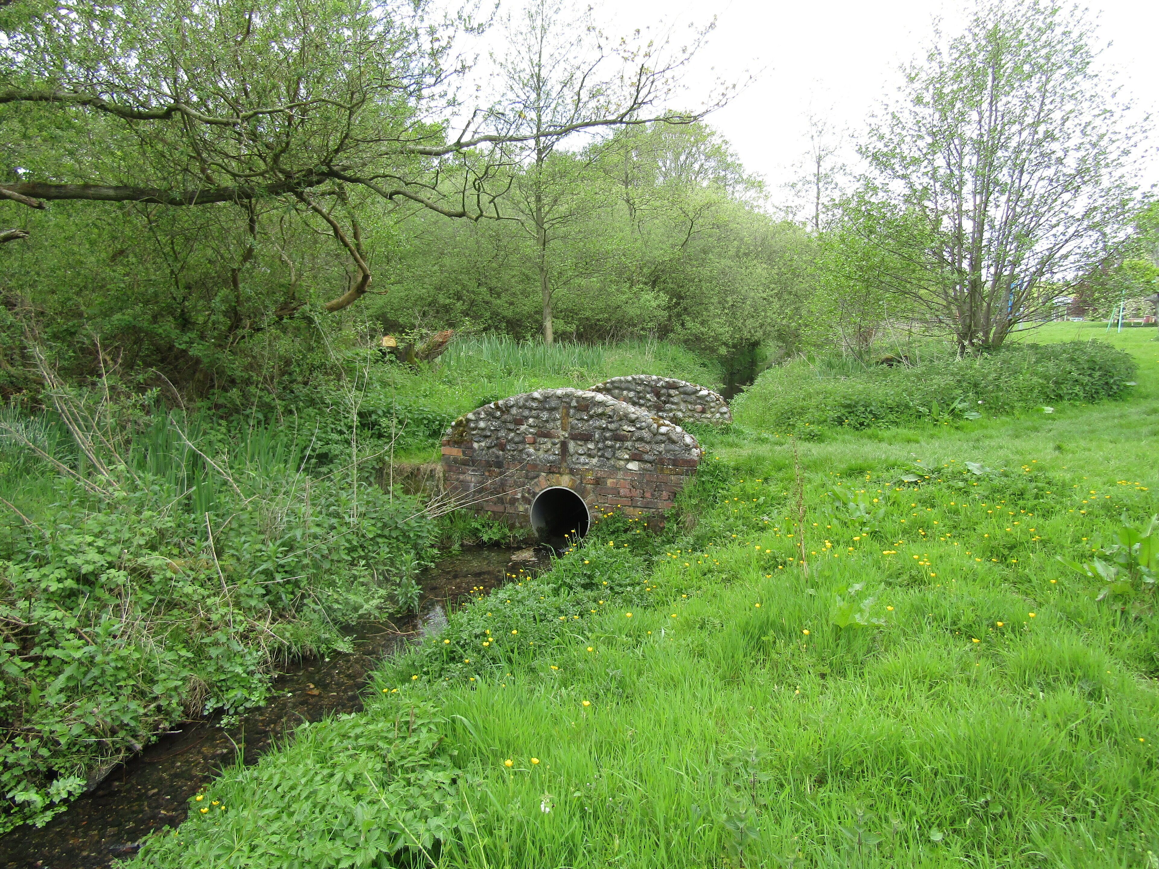 A small footbridge which crosses the stream of Hagon Beck on Roughton common in the village of Roughton, Norfolk, England.