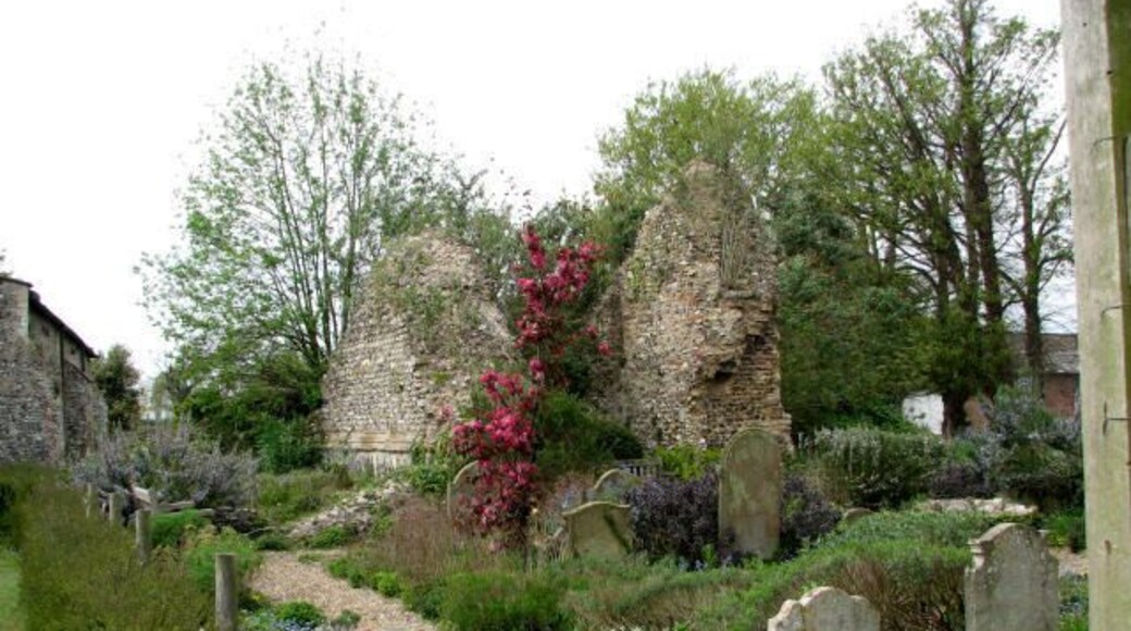 The Sacristy Garden. Perhaps the reason for there being two churches in close proximity to each other can be explained with the layout of paths and lanes, which may have made it convenient for worshippers of the two adjacent parishes to share a common churchyard. The former church of St Lawrence was gutted by fire in 1827 and after having been struck by lighning, its tower fell in 1971. The ruins have been restored and now serve as the parish hall. The ruined tower > 584395 is surrounded by a sacristy garden planted with herbs. For more detailed information see http://www.norfolkchurches.co.uk/swalshamlawrence/swalshamstlawrence.htm