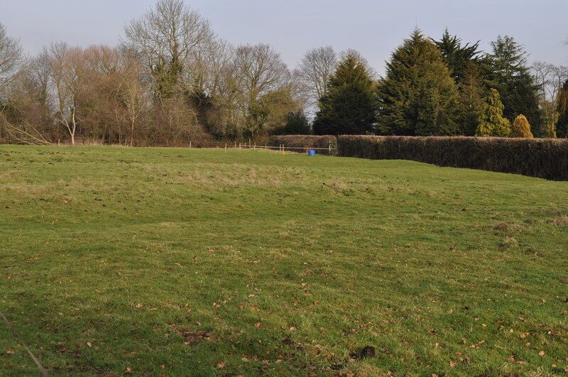 Possibly the old Glebe land Every parish church had a small parcel of land to grow crops on, this triangle may be just that. There is evidence of old farming techniques on it.