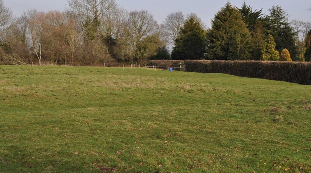 Possibly the old Glebe land Every parish church had a small parcel of land to grow crops on, this triangle may be just that. There is evidence of old farming techniques on it.