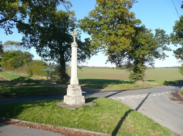 Wayside Cross, Church Road, Aylmerton This is a medieval cross, but was restored in the 19C, when it appears that most of the shaft and all the head were renewed. The road to the right is Church Road, leading to Aylmerton village, and the track half-left is a byway leading to East Beckham.