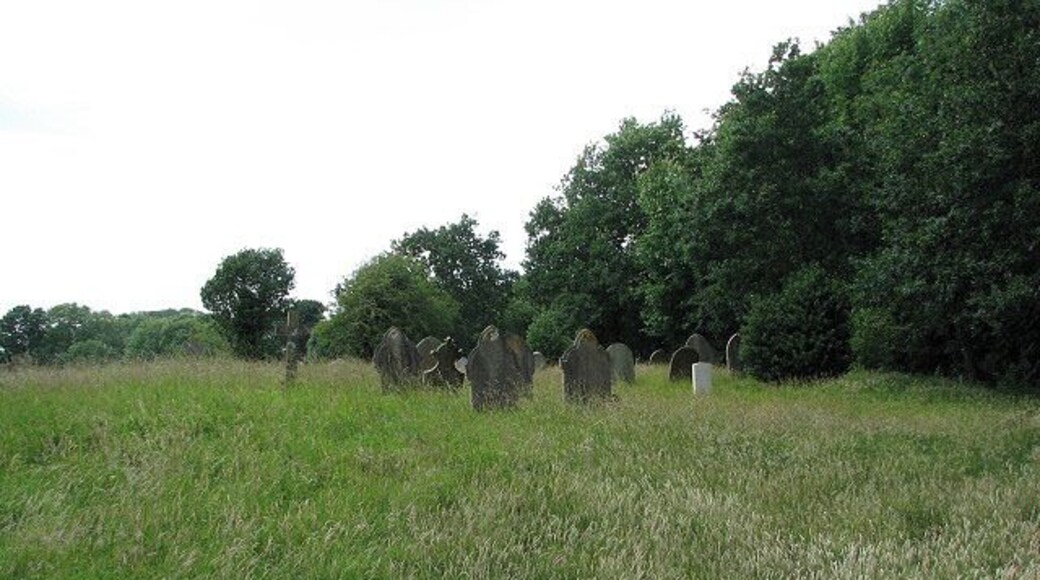 The church of SS Peter & Paul - churchyard The northern section. The church of SS Peter & Paul > 879032 - 879043 - 879056 appears to once have had transepts and the former north and south chapels are marked by their respective arches > 879046. Its interior is plain, with the benches having been replaced by chairs. All that remains of an old wallpainting depicting St Christopher, on the north wall opposite the south doorway, is the depiction of a fish > 879048. The octagonal font is C15 > 879059. The church is open every day. For more information see: http://www.norfolkchurches.co.uk/oulton/oulton.htm