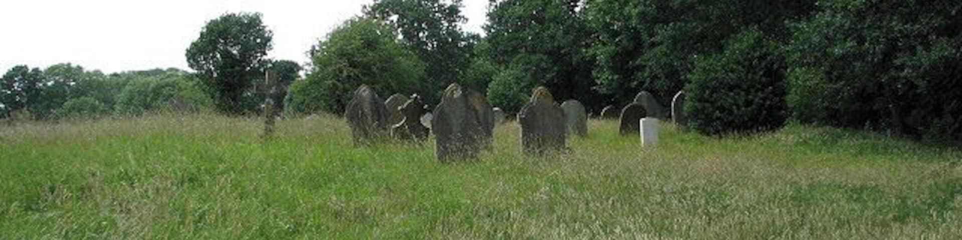 The church of SS Peter & Paul - churchyard The northern section. The church of SS Peter & Paul > 879032 - 879043 - 879056 appears to once have had transepts and the former north and south chapels are marked by their respective arches > 879046. Its interior is plain, with the benches having been replaced by chairs. All that remains of an old wallpainting depicting St Christopher, on the north wall opposite the south doorway, is the depiction of a fish > 879048. The octagonal font is C15 > 879059. The church is open every day. For more information see: http://www.norfolkchurches.co.uk/oulton/oulton.htm