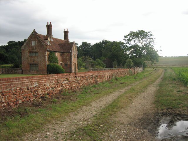 Handsome house beside the footpath, s. of Thurning The map says: "Manor Farm" and the house reminds of a very different era from our own.