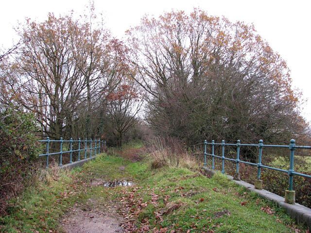 A disused railway bridge. Over Blackwater Beck, viewed in easterly direction along the Weavers Way. See also > 1062582. This section of the Weavers Way follows the dismantled railway trackbed of the former Midland and Great Northern Joint Railway. The Weavers Way is a long-distance footpath which links Cromer with Great Yarmouth; the path has a length of 90 kilometres and passes through the Norfolk Broads.