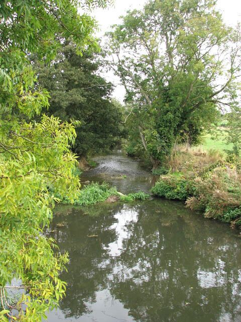 View north-east (downstream) along the River Tas. The River Tas rises near Carlton Fen (near New Buckenham) and then flows northwards for approximately 20 miles before joining the River Yare at Trowse - just south of Norwich. The Tas valley contains many interesting historical sites including an Iron Age hill fort > 1355699 at Tasburgh, the old Roman settlement of Venta Icenorum > 1352695 - now Caistor St Edmund - and the site of a woodhenge > 1391552 at Arminghall. During Roman times, the river was an important resource for the people of Venta Icenorum. Over the centuries, the Tas has also been visited by two of England's finest poets: William Wordsworth in 1790, and Philip Larkin.