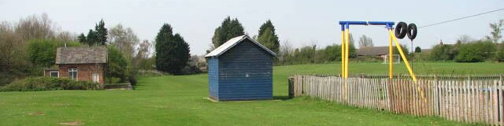 Corpusty - children's playground. The children's playground and adjoining football ground are located where once the railway station and goods yard used to be. Only the station building and a platform (seen in background at left) remain of the railway station and goods yard. The station, officially known as Corpusty & Saxthorpe, was a stop on the M&GN (Midland and Great Northern Joint Railway) route between Melton Constable and Great Yarmouth. The station was closed in 1959, the bridge > 1257349 is half filled-in and the trackbed removed. Some of it is buried under a playing field and some has been planted over > 1257355 - most of what remains is overgrown and impassable > 1257344. The villages Corpusty and Saxthorpe, situated either side of the river Bure, merge into each other. Each village has their own church but St Andrew's > https://www.geograph.org.uk/photo/309082 serves both villages ever since Corpusty's Saint Peter's > https://www.geograph.org.uk/photo/873327 - located on the outskirts of the village and separated from it by the busy B1149 - closed and came in the care of the Friends of Friendless Churches.