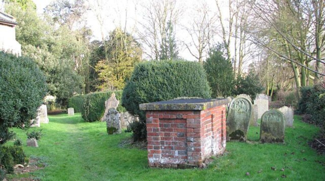 All Saints Church - footpath through churchyard. For a view of All Saints church see > 1614081. This public footpath turns off The Street. It traverses the churchyard and follows a track across fields to the north of it, leading to the village of Wreningham, further to the north-east.