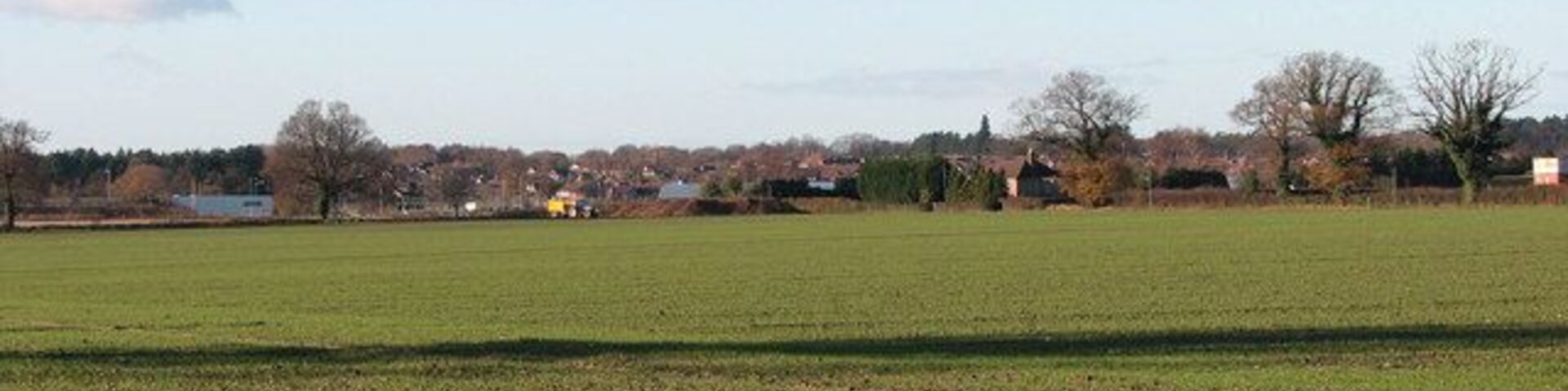 Field adjoining path. This view was taken from a public footpath which starts at Smee Lane > 919906 and leads to the A47, further to the south > 1068458 - 1068463. The field seen in the foreground, with a winter crop growing, adjoins the path in the west. Thorpe St Andrew can be seen in the distance (in adjacent grid square).