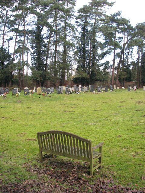 The church of SS Peter and Paul - seat in churchyard. For a view of the church see > 1702998.