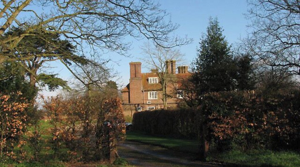 Entrance to Dudwick House. The building seen in the background is Dudwick House. Dudwick House is believed to stand on the location of the Old Dudwick Manor house, thought to have been rebuilt in the 17th century. In the 18th century the estate was owned by members of the Wright/Sewell families who lived in Buxton for many generations and in 1843 John Wright made extensive alterations. Mary Wright, a sister of John Wright of (old) Dudwick House, was a famous author of children's books and her daughter Anna (1820-1878) became famous by writing Black Beauty > 667394 - 597716. Dudwick House was rebuilt again in 1938 by R.G Carter as builder and Sir Guy Dauber as architect. http://www.buxton-norfolk.co.uk/h_houses.htm