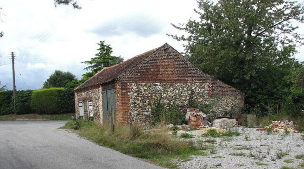 Flint and brick barn This building stands by the junction of The Green with Marsh Road.